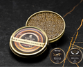 Open Cavian Beluga Imperial Huso Huso caviar tin with lid placed in front and award badges on a dark marble background.