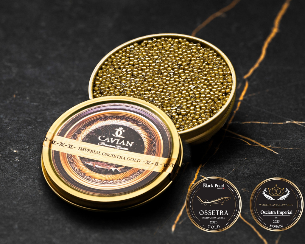 Open Cavian Imperial Oscietra Gold caviar tin with lid placed in front and award badges on a dark marble background.